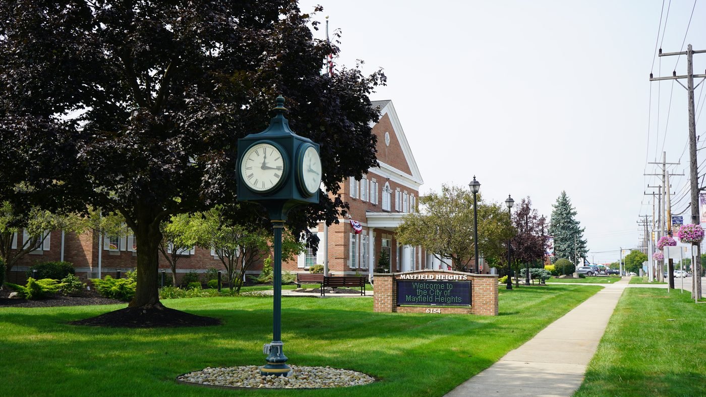 A Mayfield Heights city sign on a tree-lined street